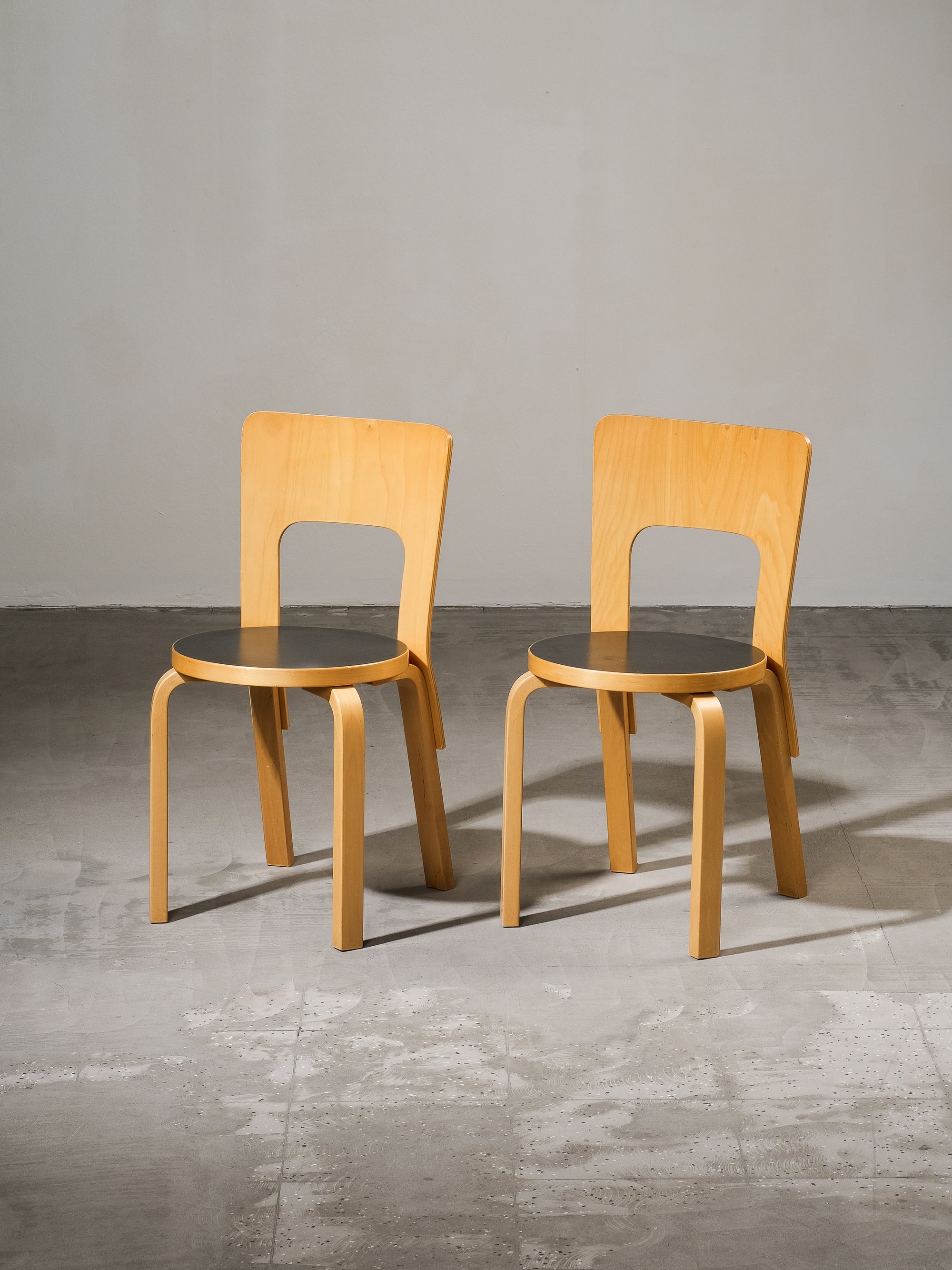 Pair of Model 66 Chairs with Black Linoleum Seat by Alvar Aalto for Artek