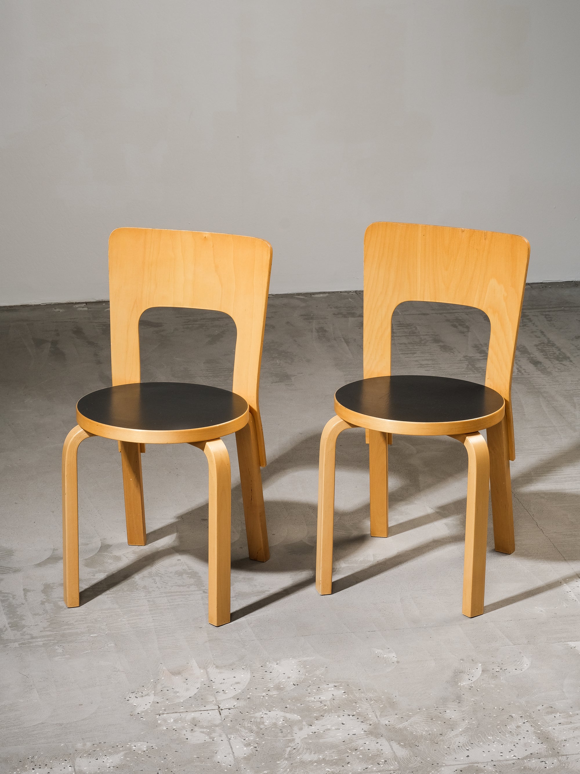 Pair of Model 66 Chairs with Black Linoleum Seat by Alvar Aalto for Artek