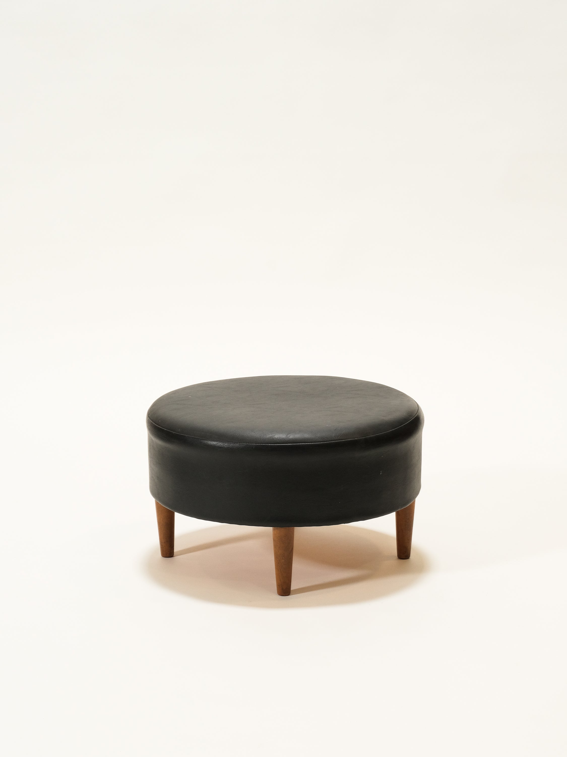 Black Round Leatherette Ottoman / Footstool